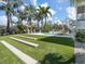 The backyard offers bocce ball court, pool and tropical landscaping at 497 Island Cir, Sarasota, FL 34242