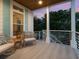 Relaxing balcony with comfortable seating offers serene outdoor living space at 497 Island Cir, Sarasota, FL 34242