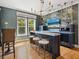 Entertainer's bar with custom lighting, countertops, seating, and ocean view at 497 Island Cir, Sarasota, FL 34242