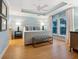 Tranquil bedroom showcasing a tray ceiling, neutral tones, and large windows, creating a peaceful retreat at 497 Island Cir, Sarasota, FL 34242