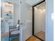 Interior elevator for easy access between floors. Display shelving and chair are visible outside the elevator at 497 Island Cir, Sarasota, FL 34242
