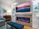 Elegant living room showcasing a modern fireplace, display shelving, and comfortable seating arrangements at 497 Island Cir, Sarasota, FL 34242