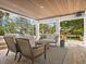 Stylish outdoor living space featuring comfortable seating and a spiral staircase at 497 Island Cir, Sarasota, FL 34242