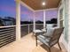 Cozy outdoor porch area with comfortable seating, offering a relaxing space to enjoy the surroundings at 497 Island Cir, Sarasota, FL 34242