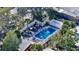 Aerial view of a community pool surrounded by houses and greenery at 500 N Jefferson Ave # 5, Sarasota, FL 34237