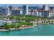 Stunning aerial view of the waterfront with lush trees, city skyline, and calm, clear water at 500 N Jefferson Ave # 5, Sarasota, FL 34237