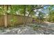 Landscaped yard with privacy fence and mature trees at 500 N Jefferson Ave # 5, Sarasota, FL 34237