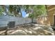 Shady backyard with white fencing, chairs, and greenery at 500 N Jefferson Ave # 5, Sarasota, FL 34237
