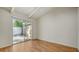 Bright bedroom featuring a sliding door to the backyard, laminate flooring, and vaulted ceilings at 500 N Jefferson Ave # 5, Sarasota, FL 34237