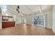 Open-concept living space with vaulted ceiling and wood-look floors at 500 N Jefferson Ave # 5, Sarasota, FL 34237
