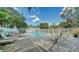 Community pool with lounge chairs, greenery, and shade at 500 N Jefferson Ave # 5, Sarasota, FL 34237