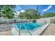 Community pool area surrounded by a white fence at 500 N Jefferson Ave # 5, Sarasota, FL 34237