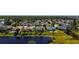 An aerial view of a house surrounded by trees and a pond in a residential neighborhood at 5022 46Th W St, Bradenton, FL 34210