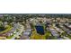 Overhead view of a residential area showing neat lawns, backyard pools, and a scenic pond at 5022 46Th W St, Bradenton, FL 34210