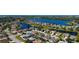 Aerial view of a residential neighborhood featuring lake views and well-maintained homes at 5022 46Th W St, Bradenton, FL 34210