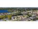 Aerial shot of a lakeside community with numerous homes, mature trees, and serene water views at 5022 46Th W St, Bradenton, FL 34210