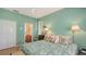 Bright bedroom features floral accents, hardwood floors, and access to the ensuite bathroom at 5022 46Th W St, Bradenton, FL 34210