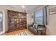 Bedroom featuring hardwood floors, love seat, large armoire, and natural light at 5022 46Th W St, Bradenton, FL 34210