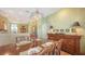 Dining room with a dark wood table, ornate chairs, and elegant chandelier at 5022 46Th W St, Bradenton, FL 34210