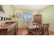Dining room with an antique chandelier and a dining table set for a meal at 5022 46Th W St, Bradenton, FL 34210