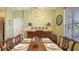 Dining room featuring a dark wood table, ornate chairs, and a striking chandelier at 5022 46Th W St, Bradenton, FL 34210