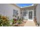 Inviting screened entrance area with decorative accents and potted plants, adding a touch of charm at 5022 46Th W St, Bradenton, FL 34210