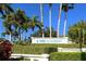 IMG Academy entrance with a sign surrounded by various palm trees and greenery at 5022 46Th W St, Bradenton, FL 34210