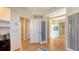 Spacious entryway featuring hardwood floors and access to various rooms in the house at 5022 46Th W St, Bradenton, FL 34210