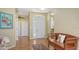 Inviting foyer featuring hardwood floors and a decorative front door with transom window at 5022 46Th W St, Bradenton, FL 34210