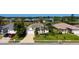 Lovely single-Gathering home displays a manicured lawn, two-car garage, and beautiful landscaping at 5022 46Th W St, Bradenton, FL 34210