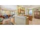 Open kitchen area featuring granite countertops, wood cabinets, and seamless flow at 5022 46Th W St, Bradenton, FL 34210