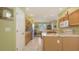 A bright eat-in kitchen with stainless steel refrigerator and granite countertops at 5022 46Th W St, Bradenton, FL 34210