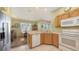 Open kitchen area with granite countertops, stainless steel appliances, and a view into dining room at 5022 46Th W St, Bradenton, FL 34210