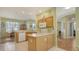 Bright kitchen featuring granite counters, modern appliances, and a breakfast nook near large windows at 5022 46Th W St, Bradenton, FL 34210