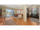 Bright living room with sliding glass doors, ceiling fan, and hardwood flooring at 5022 46Th W St, Bradenton, FL 34210