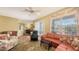 Inviting living room with hardwood floors and a leather sofa near sliding glass doors to the patio at 5022 46Th W St, Bradenton, FL 34210