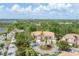 Beautiful community featuring tile roof townhomes, lush landscaping, and circular driveway at 5405 46Th W Ct, Bradenton, FL 34210
