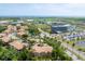 Community aerial view with beautiful landscaping, pond, and community amenities, including a pool at 5405 46Th W Ct, Bradenton, FL 34210