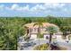 Attractive townhome featuring an attached garage, covered entry, and a lush landscaped circular driveway at 5405 46Th W Ct, Bradenton, FL 34210