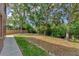Expansive backyard with lush greenery and shade trees perfect for outdoor activities and relaxation at 5405 46Th W Ct, Bradenton, FL 34210