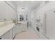 Bright kitchen with white cabinets, stainless appliances, and open layout at 5405 46Th W Ct, Bradenton, FL 34210