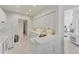 Open kitchen layout featuring white cabinetry, countertops, and modern appliances at 5405 46Th W Ct, Bradenton, FL 34210