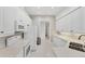 Modern kitchen features white cabinets, subway tile backsplash, and sleek appliances at 5405 46Th W Ct, Bradenton, FL 34210