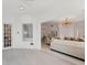 Bright living room features a comfortable couch, chandelier, and open concept to other rooms at 5405 46Th W Ct, Bradenton, FL 34210