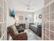 A multi-purpose bedroom featuring a daybed, desk, and comfy reading chair at 5480 White Ibis Dr, North Port, FL 34287