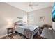 Comfortable bedroom with cozy furniture, natural light, wood floors, and modern decor at 5480 White Ibis Dr, North Port, FL 34287
