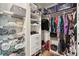Walk-in closet with custom shelving and ample storage for clothing and accessories at 5480 White Ibis Dr, North Port, FL 34287