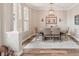 Elegant dining room with modern decor, wood floors, and a decorative light fixture at 5480 White Ibis Dr, North Port, FL 34287