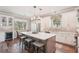 Bright kitchen featuring a large island, stainless steel appliances, and ample counter space at 5480 White Ibis Dr, North Port, FL 34287
