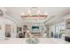 Open-concept living room with modern decor and a large flat-screen TV at 5480 White Ibis Dr, North Port, FL 34287